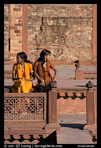 Young women sitting in the center of Ornamental pool. Fatehpur Sikri, Uttar Pradesh, India