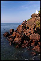 Boulders and christian statues overlooking ocean, Dona Paula. Goa, India