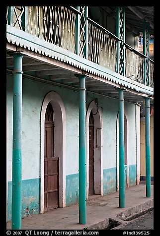 House with balconies painted green, Panjim. Goa, India