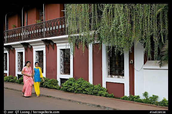Women strolling past the heritage Panaji Inn, Panjim. Goa, India (color)