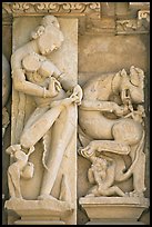 Sculpture of woman removing thorn from foot, Parsvanatha temple, Eastern Group. Khajuraho, Madhya Pradesh, India ( color)