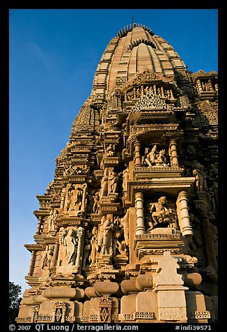 Bands of carved sculptures below spire (sikhara), Javari Temple, Eastern Group. Khajuraho, Madhya Pradesh, India