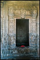 Inner sanctum with flowers and Vishnu image, Javari Temple, Eastern Group. Khajuraho, Madhya Pradesh, India