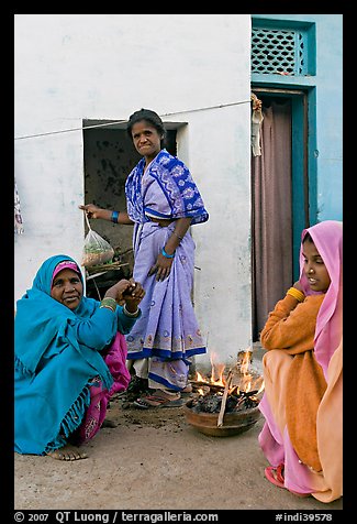 Women cooking outside in village. Khajuraho, Madhya Pradesh, India (color)
