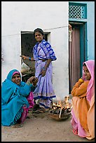 Women cooking outside in village. Khajuraho, Madhya Pradesh, India