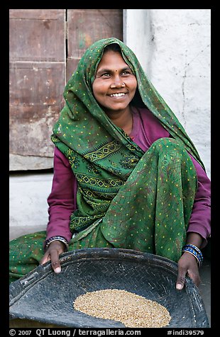 Woman sorting grains. Khajuraho, Madhya Pradesh, India (color)