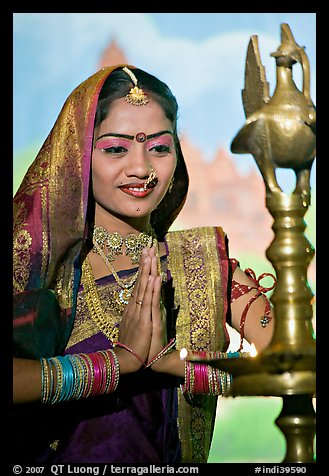 Woman joining hands in prayer gesture, Kandariya show. Khajuraho, Madhya Pradesh, India