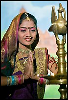 Woman joining hands in prayer gesture, Kandariya show. Khajuraho, Madhya Pradesh, India