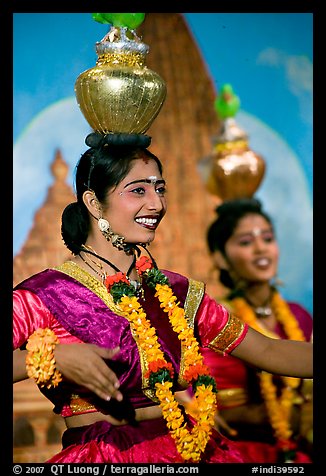 Women dancing with jars on head, Kandariya show. Khajuraho, Madhya Pradesh, India (color)
