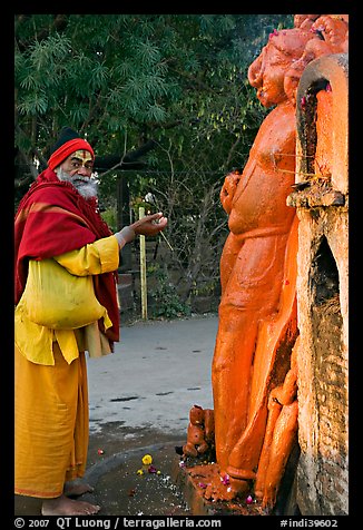 Holy man worshiping Shiva image. Khajuraho, Madhya Pradesh, India