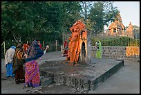 Women throwing water at  Shiva image. Khajuraho, Madhya Pradesh, India ( color)