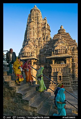 Worshipers going down stairs in front of Lakshmana temple. Khajuraho, Madhya Pradesh, India