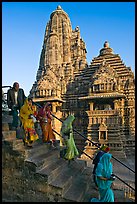 Worshipers going down stairs in front of Lakshmana temple. Khajuraho, Madhya Pradesh, India