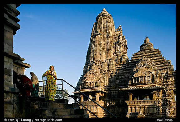 Woman with offering pot in front of Lakshmana temple. Khajuraho, Madhya Pradesh, India