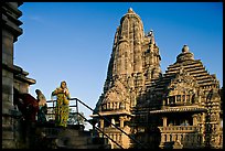 Woman with offering pot in front of Lakshmana temple. Khajuraho, Madhya Pradesh, India ( color)