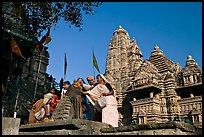 Worshippers making offering at Matangesvara temple with  Lakshmana behind. Khajuraho, Madhya Pradesh, India ( color)