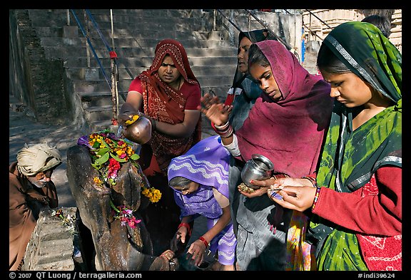 Women offering to an image at Matangesvara temple. Khajuraho, Madhya Pradesh, India (color)