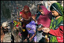 Women offering to an image at Matangesvara temple. Khajuraho, Madhya Pradesh, India (color)