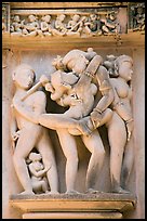 Erotic sculpture of couple in embrace, Lakshmana temple. Khajuraho, Madhya Pradesh, India (color)