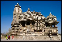 Devi Jagadamba temple with women walking. Khajuraho, Madhya Pradesh, India ( color)