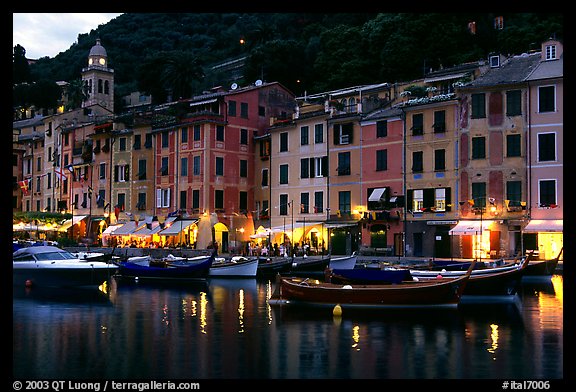 Pastes-colored houses around harbor at dusk, Portofino. Liguria, Italy (color)