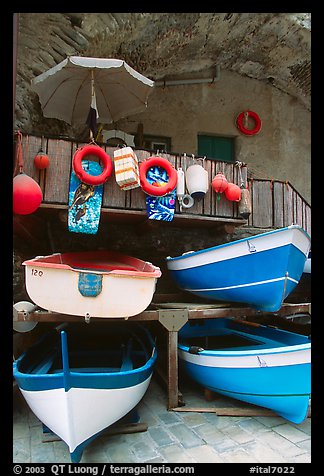 Tiny fishing boats stacked in the main square, Riomaggiore. Cinque Terre, Liguria, Italy (color)
