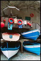Tiny fishing boats stacked in the main square, Riomaggiore. Cinque Terre, Liguria, Italy (color)