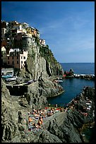 Sunbathers in Manarola. Cinque Terre, Liguria, Italy