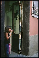 Girl enjoying gelato (ice-cream), Vernazza. Cinque Terre, Liguria, Italy ( color)