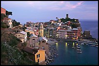 Harbor, church, medieval castle and village, sunset, Vernazza. Cinque Terre, Liguria, Italy (color)