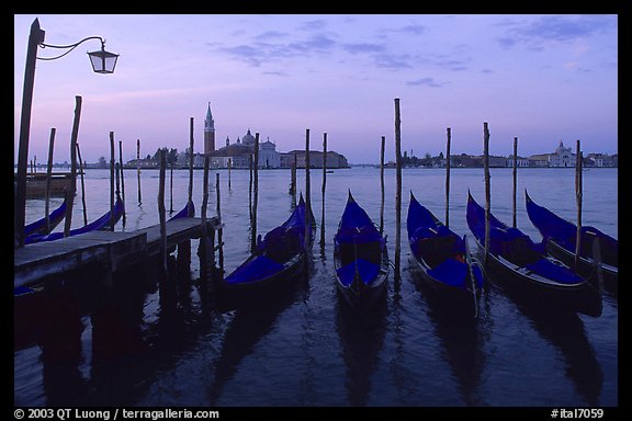 Parked gondolas, Canale della Guidecca, San Giorgio Maggiore church at dawn. Venice, Veneto, Italy (color)