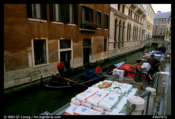 Delivery through a little canal. Venice, Veneto, Italy (color)