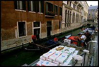 Delivery through a little canal. Venice, Veneto, Italy (color)