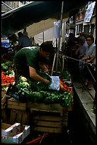 Selling fruit and vegetable from a boat on a small  canal, Castello. Venice, Veneto, Italy