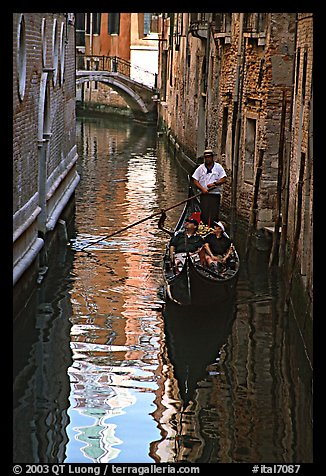 Gondola and reflections in a narrow canal. Venice, Veneto, Italy (color)