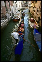 Gondolas lined up in narrow canal. Venice, Veneto, Italy (color)