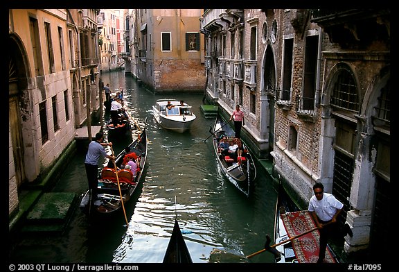 Busy water trafic in  narrow canal. Venice, Veneto, Italy (color)