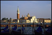 Gondolas, Canale della Guidecca, San Giorgio Maggiore church, late afternoon. Venice, Veneto, Italy (color)