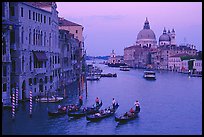 Gondolas, Grand Canal, Santa Maria della Salute church from the Academy Bridge,  sunset. Venice, Veneto, Italy