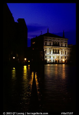 Rezzonico palace illuminated at night, along the Grand Canal. Venice, Veneto, Italy