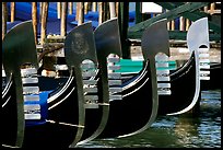 Row of gondolas prows, with their characteristic ferri. Venice, Veneto, Italy (color)