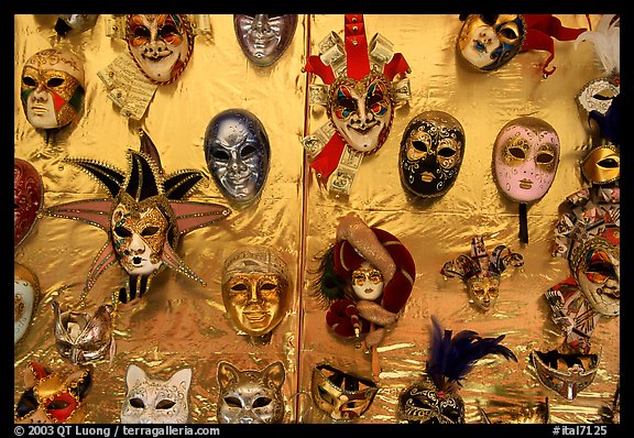 Carnival masks over golden background, Burano. Venice, Veneto, Italy