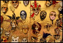 Carnival masks over golden background, Burano. Venice, Veneto, Italy (color)