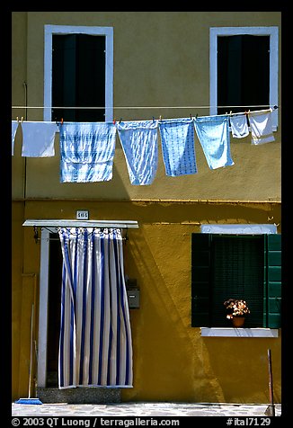 Hanging laundry and colored wall, Burano. Venice, Veneto, Italy (color)