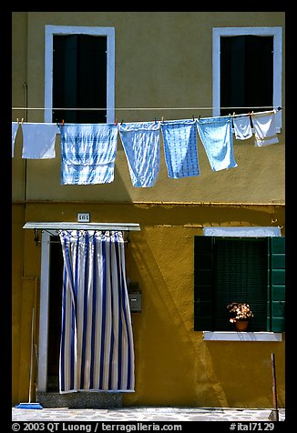 Hanging laundry and colored wall, Burano. Venice, Veneto, Italy