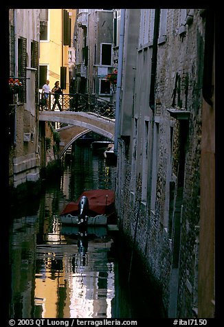 Pedestrians on a bridge over a narrow canal. Venice, Veneto, Italy (color)