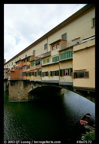Ponte Vecchio bridge covered with shops, spanning  Arno River. Florence, Tuscany, Italy (color)