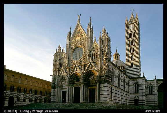 Siena Cathedral (Duomo) with bands of colored marble, late afternoon. Siena, Tuscany, Italy