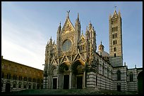 Siena Cathedral (Duomo) with bands of colored marble, late afternoon. Siena, Tuscany, Italy