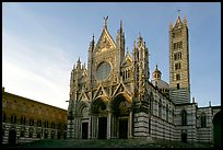 Siena Cathedral (Duomo) with bands of colored marble, late afternoon. Siena, Tuscany, Italy (color)